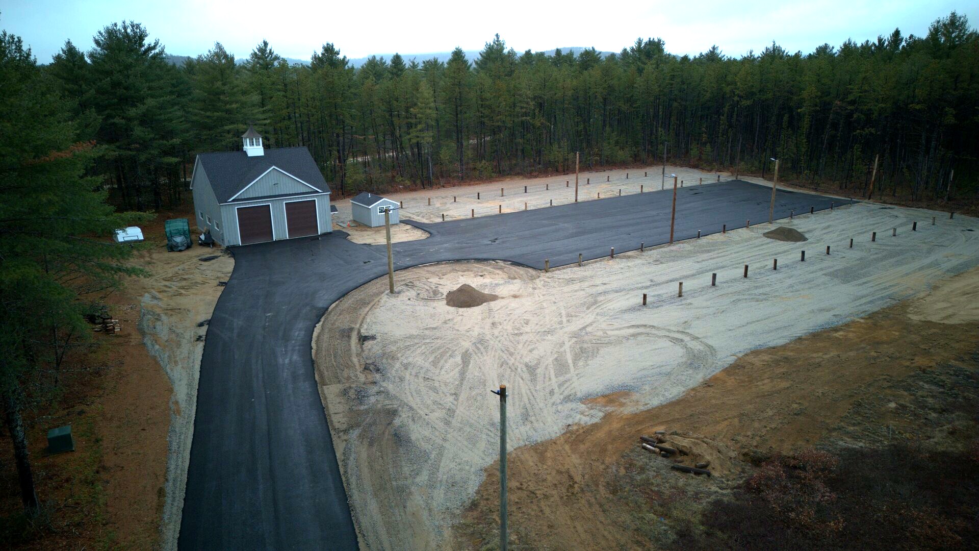 Aerial view of Northland Truck Parking facility with barn-style building and parking lot