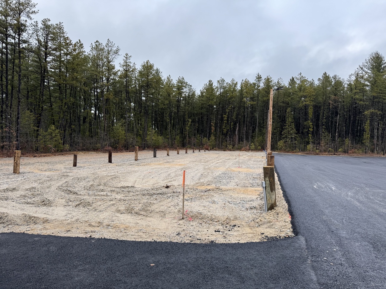Individual parking spaces marked with wooden posts